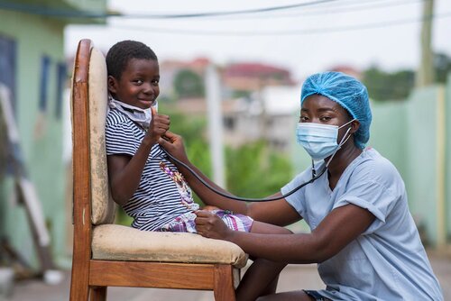Doctor diagnosing a child